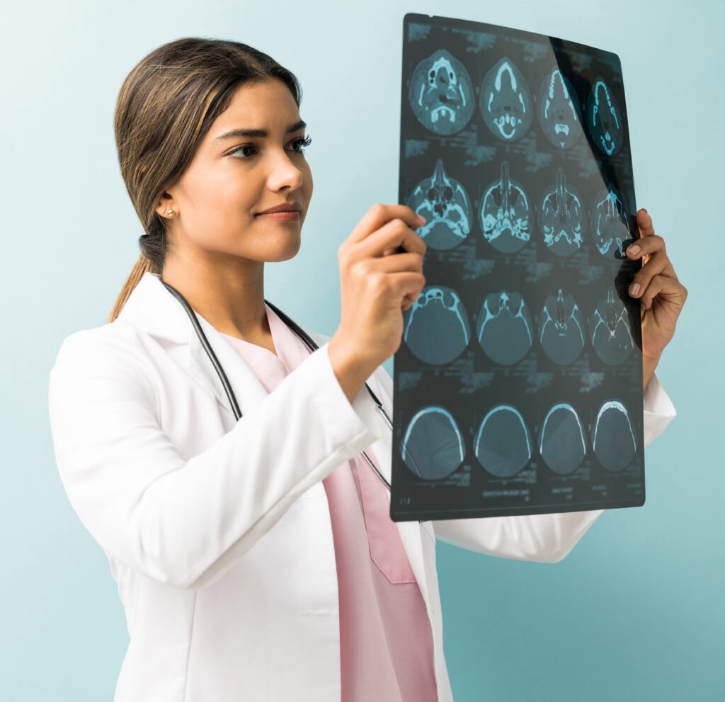 Young Practitioner With Xray Against Colored Background